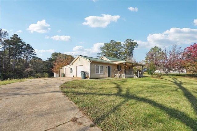 ranch-style house featuring covered porch, metal roof, and a front lawn