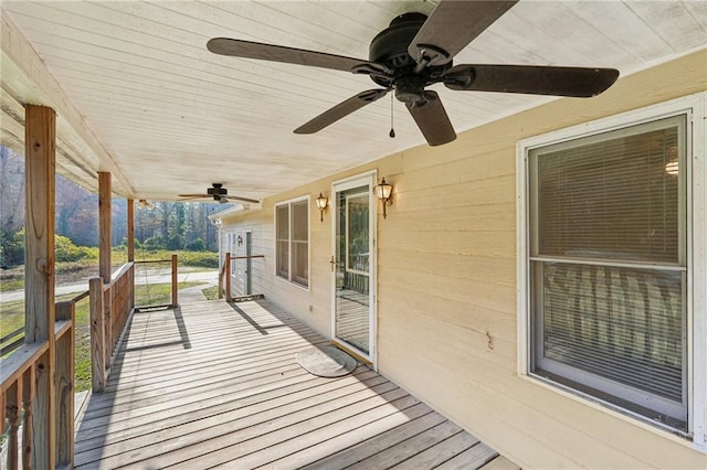 wooden terrace with a ceiling fan