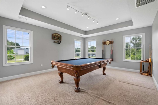 game room featuring a healthy amount of sunlight, a raised ceiling, carpet floors, and billiards