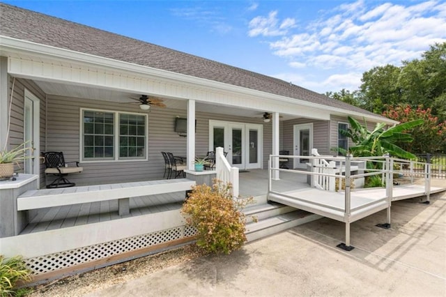 deck featuring ceiling fan, a porch, and french doors