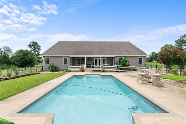 view of pool with a yard and a patio area