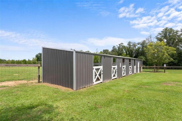 view of stable featuring a rural view