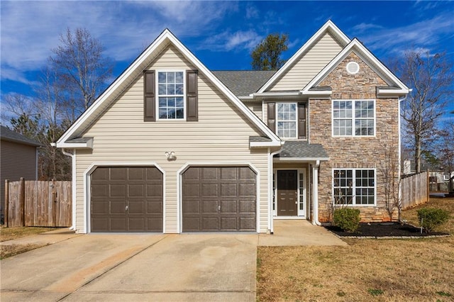 view of front property featuring a front yard and a garage