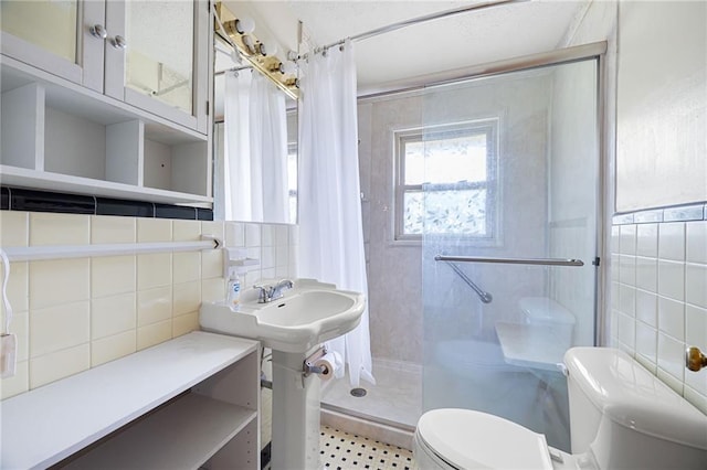 1191 S Burnt Hickory Rd, Douglasville, GA 30134 - bathroom featuring a stall shower, tile walls, and tasteful backsplash