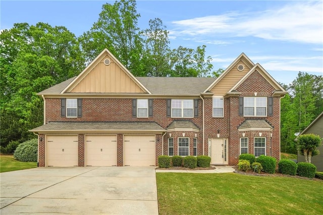view of front facade with a front yard, brick siding, board and batten siding, concrete driveway, and an attached garage