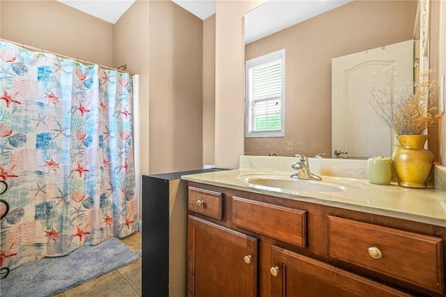 bathroom with tile patterned floors, a shower with shower curtain, and vanity