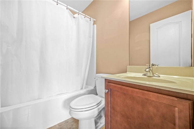 full bathroom with shower / bath combo with shower curtain, tile patterned floors, toilet, and vanity
