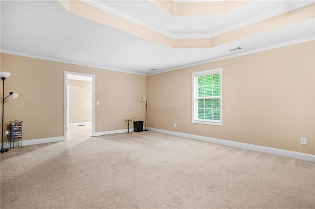 unfurnished room with baseboards, ornamental molding, and light colored carpet