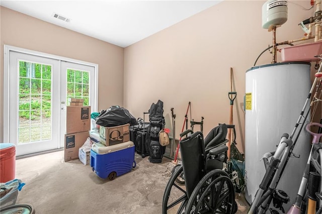 storage room featuring visible vents and water heater