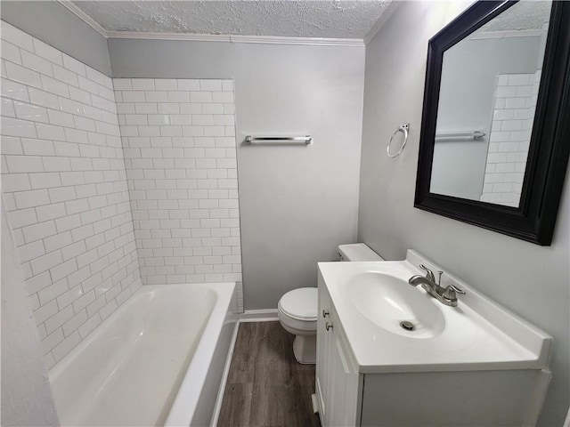 908 Davis St, Monroe, GA 30655 - full bathroom with toilet, wood finished floors, crown molding, vanity, and a textured ceiling