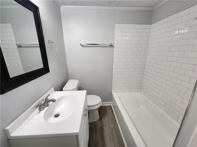 908 Davis St, Monroe, GA 30655 - bathroom with toilet, ornamental molding, wood finished floors, a textured ceiling, and vanity