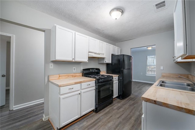 718 Dalvigney St NW, Atlanta, GA 30318 - kitchen featuring white cabinetry, butcher block countertops, and black appliances