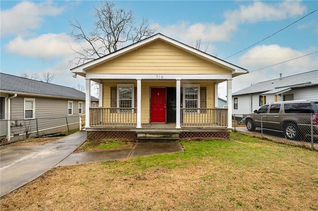 bungalow-style home with a porch and a front yard