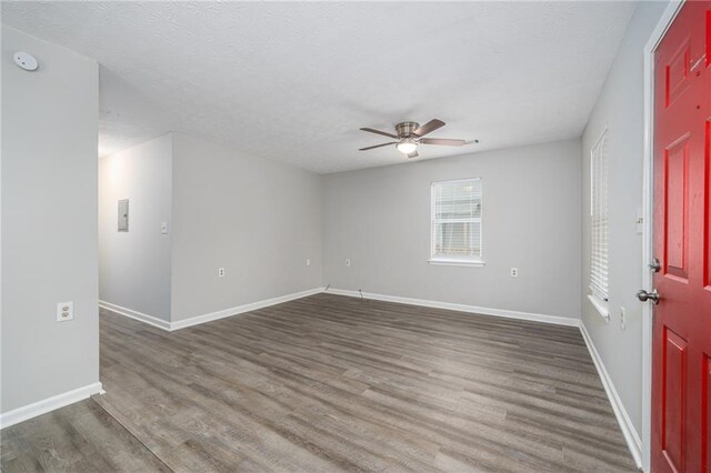 718 Dalvigney St NW, Atlanta, GA 30318 - spare room featuring ceiling fan and dark hardwood / wood-style flooring