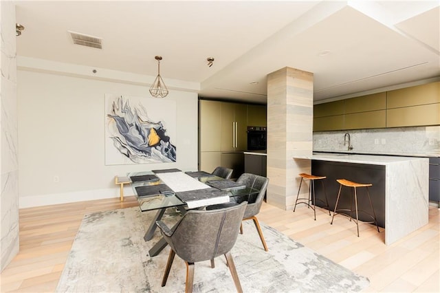 1280 W Peachtree St NW Unit 4003, Atlanta, GA 30309 - dining area with light wood finished floors and baseboards