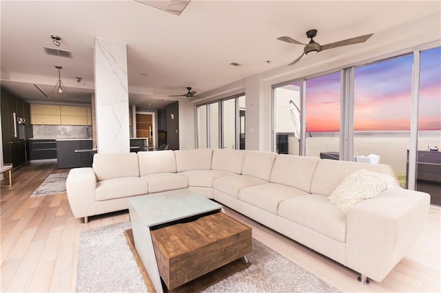 1280 W Peachtree St NW Unit 4003, Atlanta, GA 30309 - living room with ceiling fan and light wood-style floors