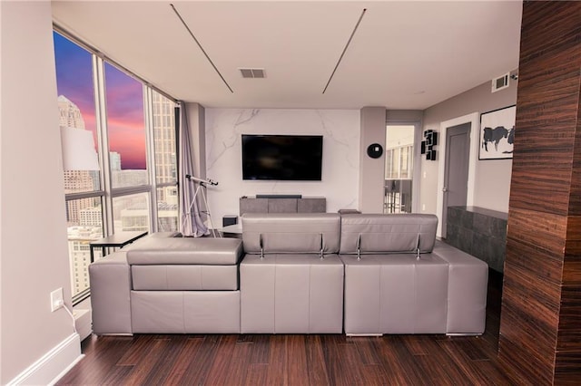 1280 W Peachtree St NW Unit 4003, Atlanta, GA 30309 - living area featuring dark wood-style floors and a wall of windows