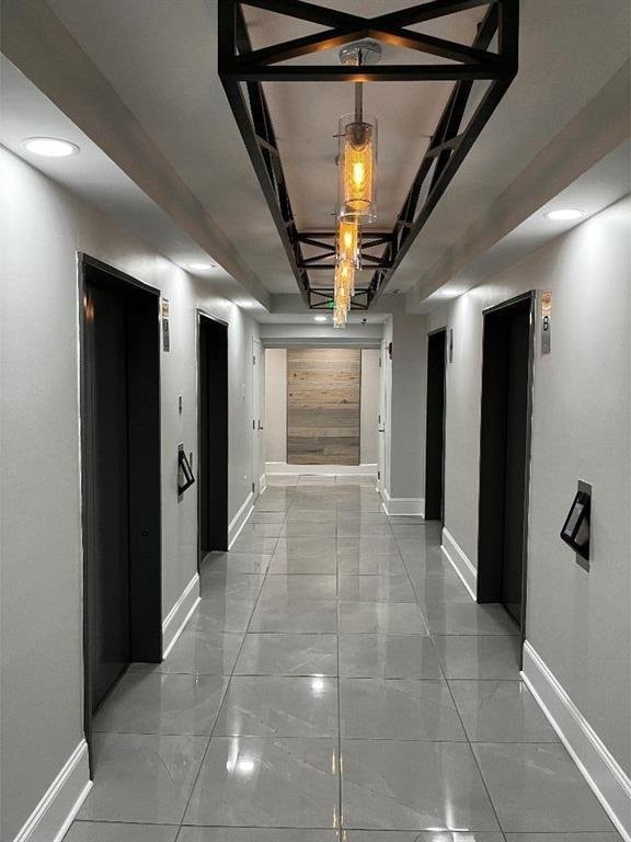 1280 W Peachtree St NW Unit 4003, Atlanta, GA 30309 - hallway with marble finish floors and recessed lighting