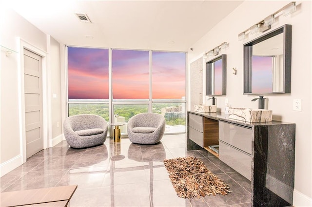1280 W Peachtree St NW Unit 4003, Atlanta, GA 30309 - bathroom featuring floor to ceiling windows, double vanity, healthy amount of natural light, and a freestanding tub