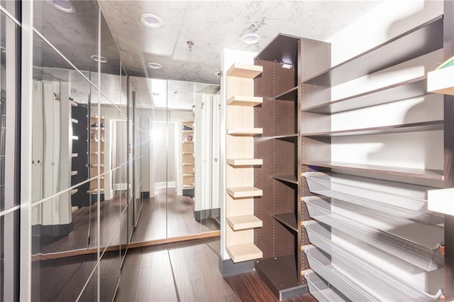 1280 W Peachtree St NW Unit 4003, Atlanta, GA 30309 - walk in closet with dark wood-style floors