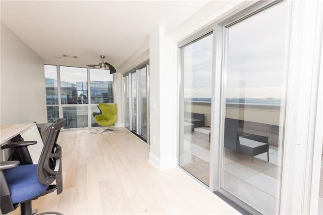 1280 W Peachtree St NW Unit 4003, Atlanta, GA 30309 - sunroom / solarium with wood finished floors and a wall of windows