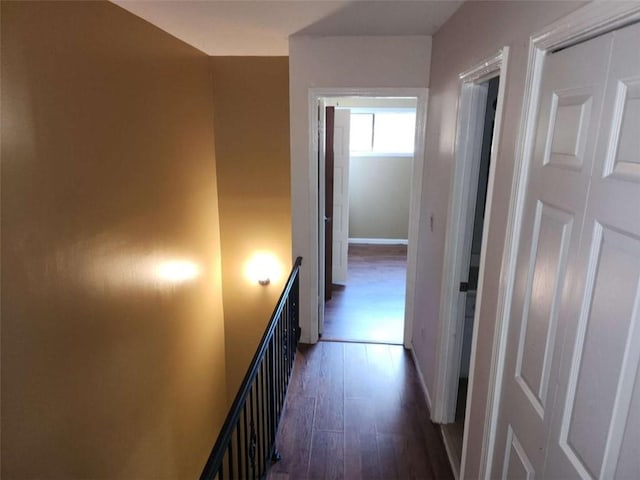 hallway with dark hardwood / wood-style floors