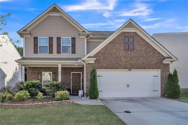 view of front of home with a garage and a front yard