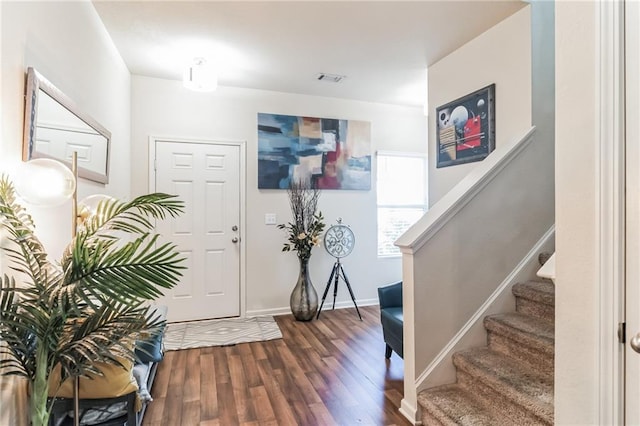 foyer with dark hardwood / wood-style flooring