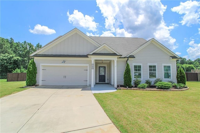 409 Glenn Trl, Winder, GA 30680 - view of front of house featuring concrete driveway, a garage, and board and batten siding