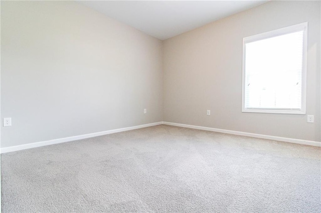 409 Glenn Trl, Winder, GA 30680 - spare room featuring carpet floors and baseboards