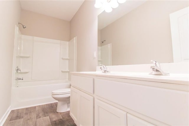 409 Glenn Trl, Winder, GA 30680 - full bath featuring double vanity, wood finished floors, and bathing tub / shower combination