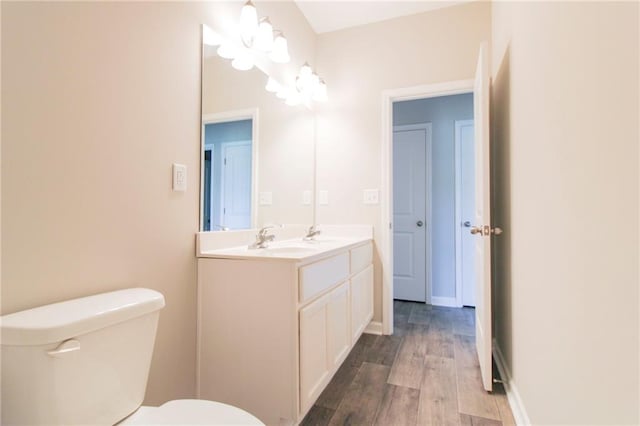 409 Glenn Trl, Winder, GA 30680 - bathroom with double vanity, a chandelier, and wood finished floors