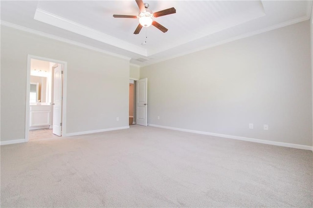 409 Glenn Trl, Winder, GA 30680 - unfurnished bedroom featuring a raised ceiling, crown molding, light carpet, ensuite bathroom, and a ceiling fan