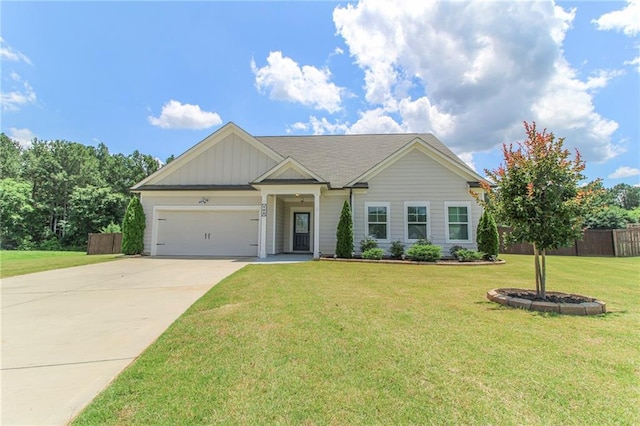 409 Glenn Trl, Winder, GA 30680 - view of front facade with driveway, a garage, and board and batten siding