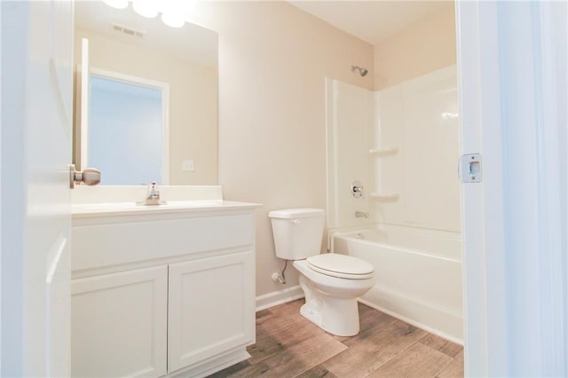 409 Glenn Trl, Winder, GA 30680 - bathroom with vanity, tub / shower combination, and wood finished floors