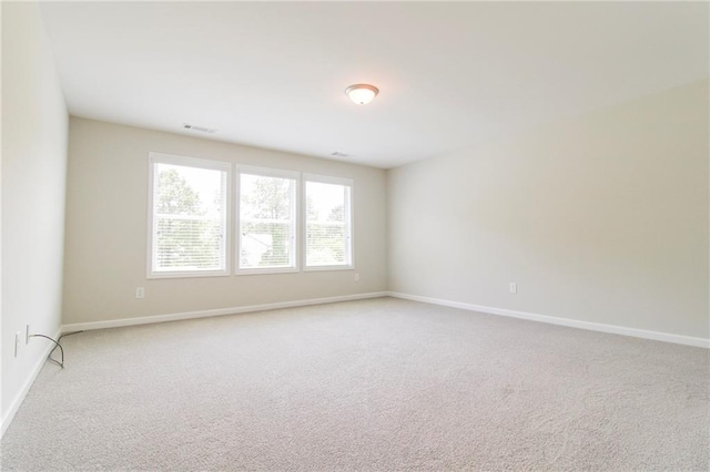 409 Glenn Trl, Winder, GA 30680 - spare room featuring carpet and baseboards