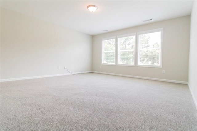 409 Glenn Trl, Winder, GA 30680 - unfurnished room featuring baseboards and light carpet