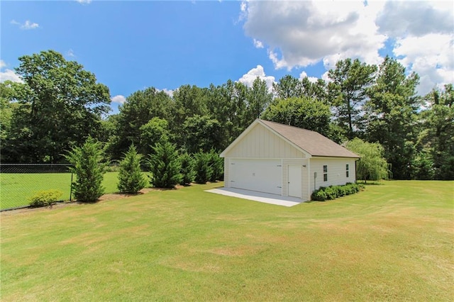409 Glenn Trl, Winder, GA 30680 - view of yard with a garage, view of scattered trees, and an outbuilding