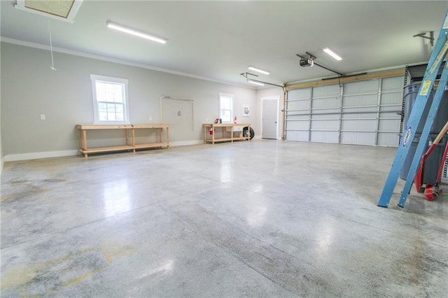 409 Glenn Trl, Winder, GA 30680 - garage with baseboards and a garage door opener