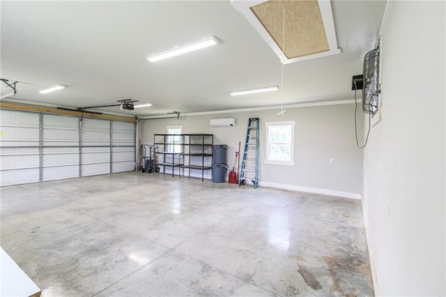 409 Glenn Trl, Winder, GA 30680 - garage with a garage door opener and baseboards