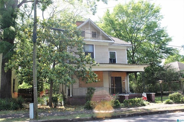 124 61st St S, Birmingham, AL 35212 - view of front facade featuring a porch and a chimney