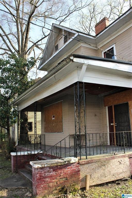 124 61st St S, Birmingham, AL 35212 - view of front of house with covered porch and a chimney