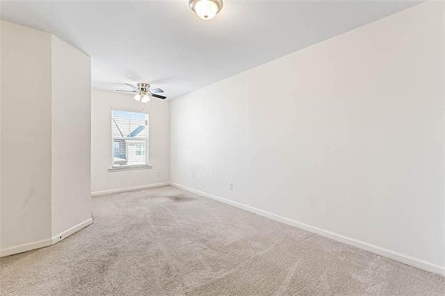 2309 Rolling Trl, Lithonia, GA 30058 - spare room with carpet, a ceiling fan, and baseboards