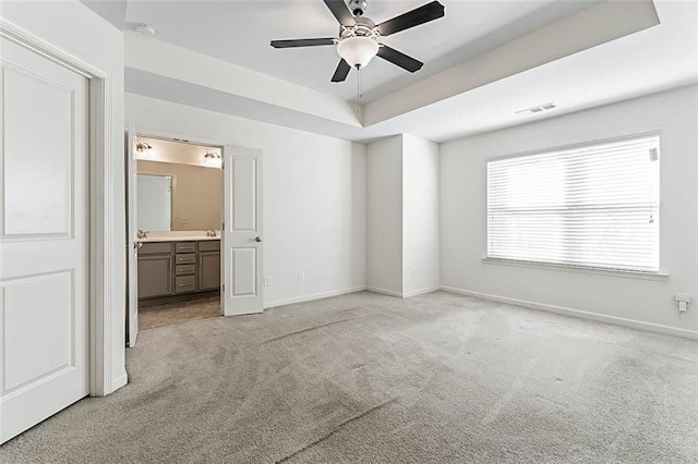 2309 Rolling Trl, Lithonia, GA 30058 - unfurnished bedroom with light colored carpet, baseboards, ensuite bath, and ceiling fan