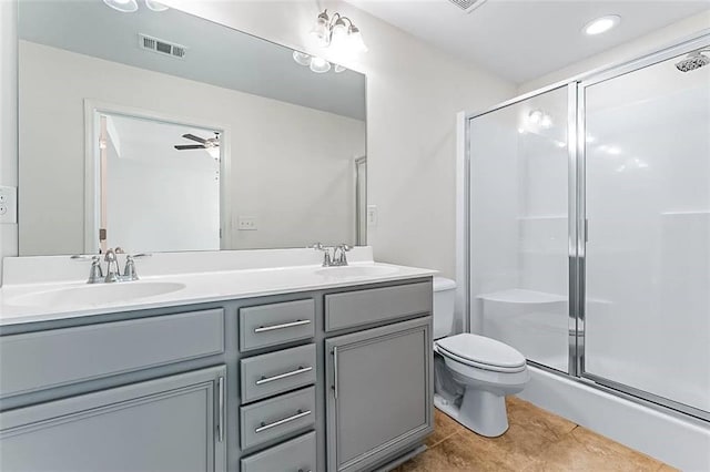 2309 Rolling Trl, Lithonia, GA 30058 - bathroom featuring double vanity, toilet, a shower stall, and tile patterned flooring