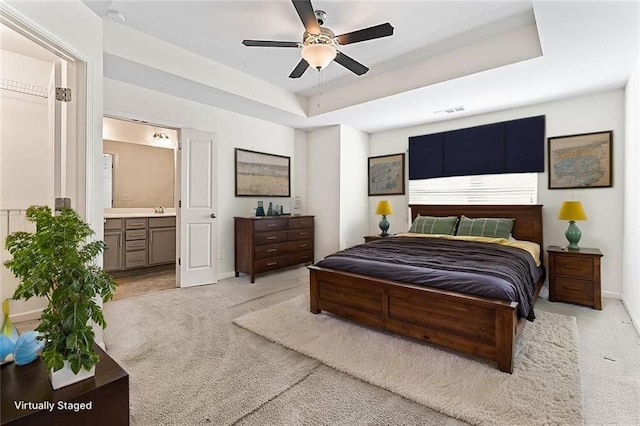 2309 Rolling Trl, Lithonia, GA 30058 - bedroom with light carpet, baseboards, ensuite bath, and a sink