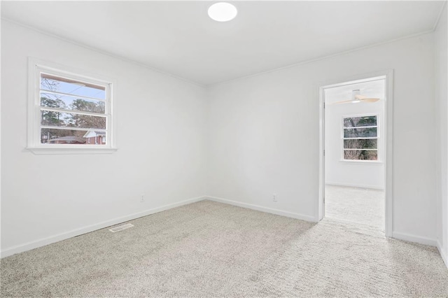 unfurnished room with light colored carpet