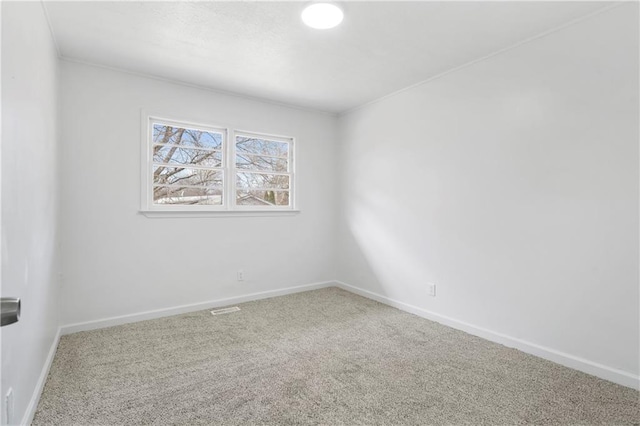 unfurnished room with carpet flooring