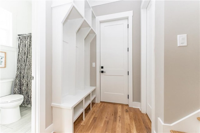 mudroom with light hardwood / wood-style floors