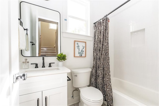 full bathroom with toilet, vanity, and shower / bathtub combination with curtain